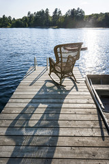 Rocking chair on small lake dock
