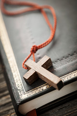 Cross on Bible