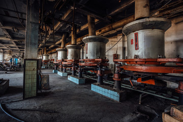 Fototapeta na wymiar Abandoned tea factory with remnant of rusty equipment 
