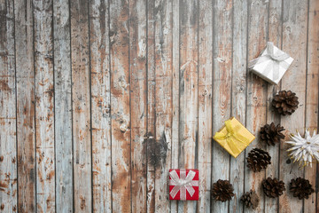 sesonal background with small gifts and pine cones