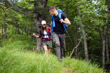 Fototapeta na wymiar Couple enjoying on their hiking trip.Travel and adventure concept