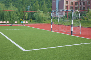 Mini Football Goal On An Artificial Grass . football goal on a green lawn