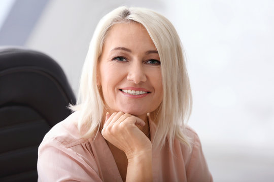 Portrait of smiling mature woman in office