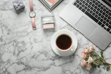 Obraz na płótnie Canvas Flat lay composition with laptop, cup of coffee and stylish accessories on marble background. Blogger concept
