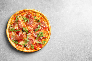 Delicious pizza with meat on light background, top view