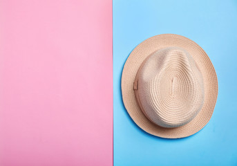 Fototapeta na wymiar Stylish hat on color background, top view. Beach resort