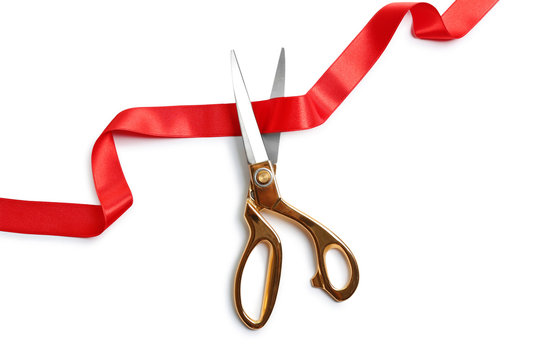 Ribbon and scissors on white background, top view. Ceremonial red tape cutting