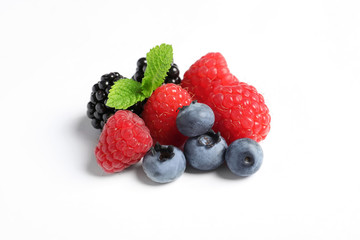 Raspberries, blackberries and blueberries on white background