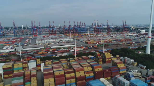Drone shot of the cargo container terminal in the Port of Hamburg, heavy industry and economy Germany