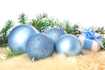 Fototapeta na wymiar Beautiful Christmas composition with festive decor and gift box on fur
