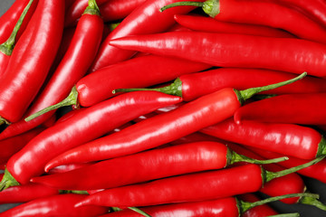 Ripe hot chili peppers as background, closeup