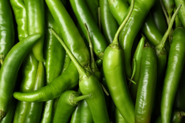 Ripe hot chili peppers as background, closeup