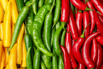 Ripe hot chili peppers as background, closeup