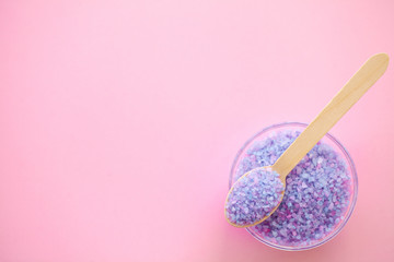 Spa. Bath Organic Salt on Wooden Spoon on Pink Background With Copy Space.