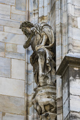  Sculptures of saints and martyrs decorating the Cathedral of Milan (Duomo di Milano) are shot close-up. 