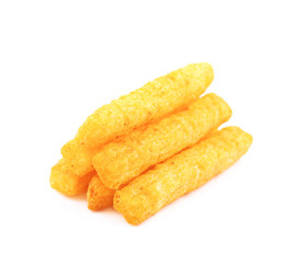 Pile of puffed cornmeal sticks isolated