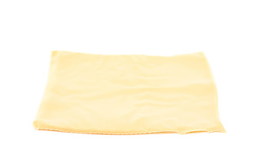 Slice of processed cheese isolated