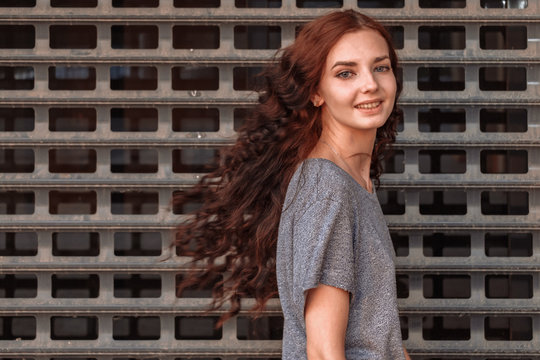 Young happy girl prisoner turning back, copyspace