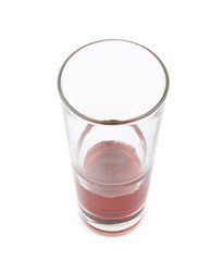 Glass of red juice isolated