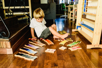 Children playing and learning with montessori color tablets