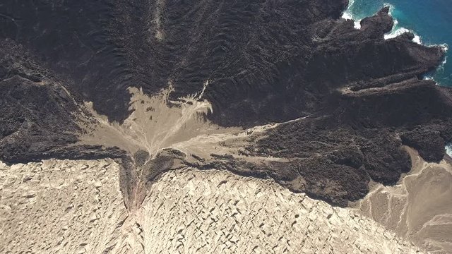 Aerial shot of volcano, cooled lava flow and Ocean  - San Benedicto, Mexico