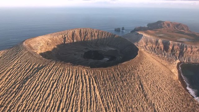 Aerial view of volcanic island, crater at sunrise - San Benedicto, Mexico