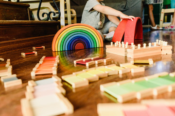 Children playing with wooden rainbow waldorf montessori