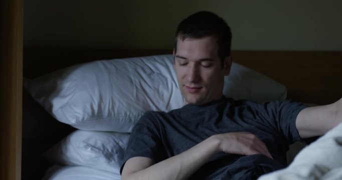 Man getting out of bed in morning - slow motion