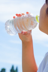 A woman or a girl who drinks water. Image of hydration, health, beauty, sports etc.  ...