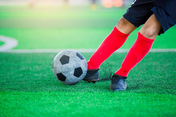 Blurry picture of The soccer player shoot ball