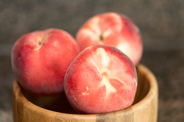Peach isolated on table. Full depth of field.