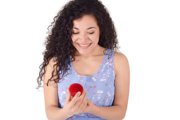 Surprised woman holding an open jewelery gift box.