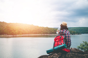 Female tourists in beautiful nature in tranquil scene, concept tourists backpack.