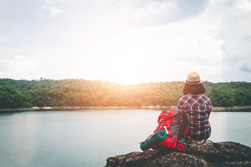 Female tourists in beautiful nature in tranquil scene, concept tourists backpack.