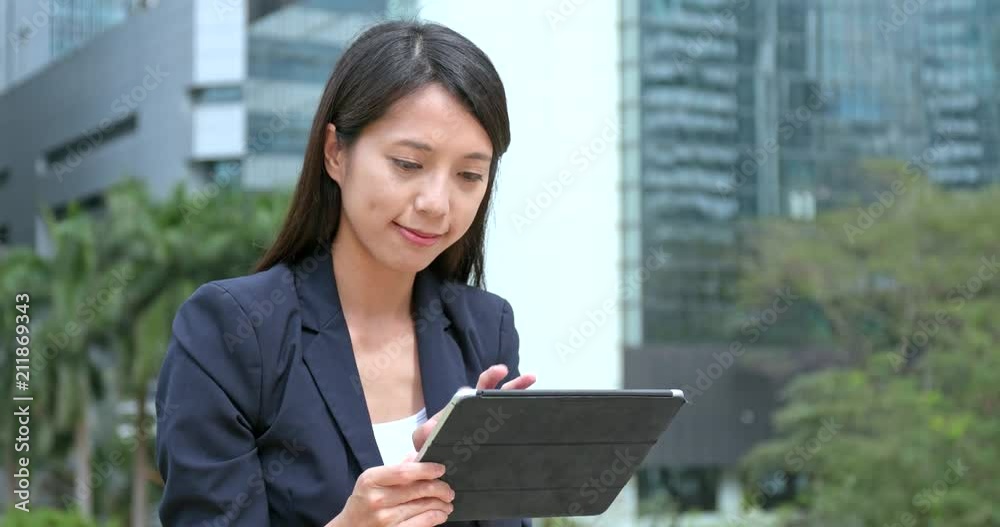 Sticker Businesswoman use of digital tablet computer at outdoor