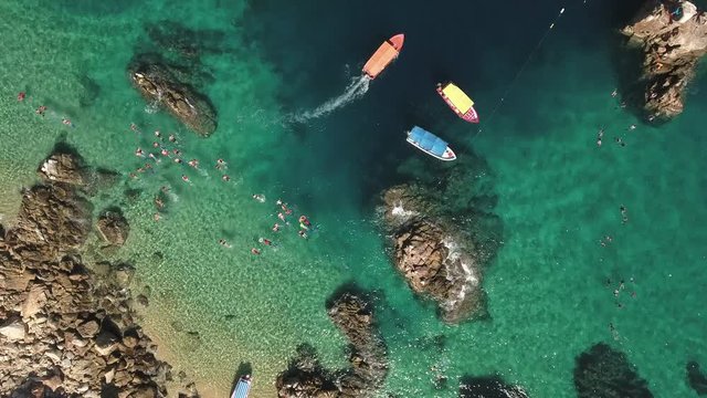 Aerial view of snorkelling people, tourists in a tropical beach - Cabo San Lucas