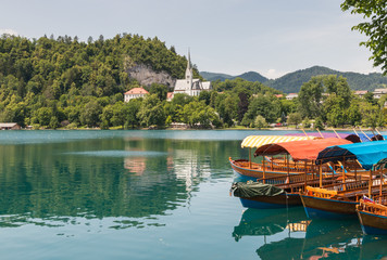 colourful boats moored on lake Bled in Slovenia