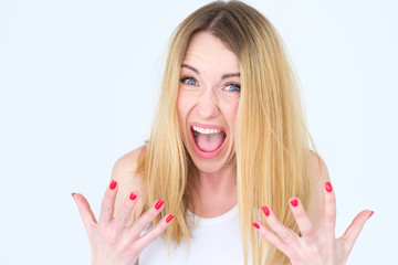 emotion face. cross angry shocked enraged woman screaming with disbelief. young beautiful blond...