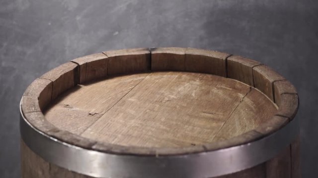 Background of barel on a wooden table, rotation 360 degrees. Beautiful dark background.	