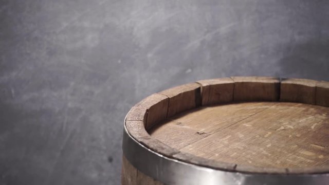 Background of barel on a wooden table, rotation 360 degrees. Beautiful dark background.	