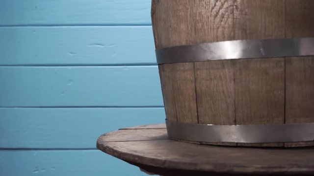 Background of barel on a wooden table, rotation 360 degrees. Beautiful  blue wooden background.	