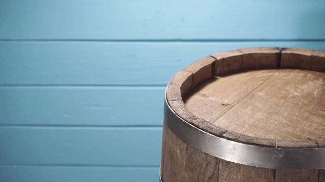 Background of barel on a wooden table, rotation 360 degrees. Beautiful  blue wooden background.	
