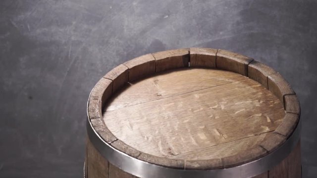 Background of barel on a wooden table, rotation 360 degrees. Beautiful dark background.	