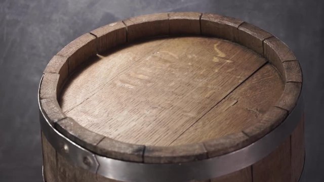 Background of barel on a wooden table, rotation 360 degrees. Beautiful dark background.	