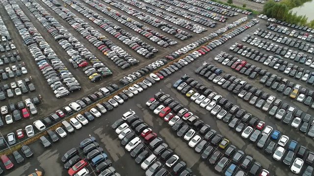 Aerial drone view of second hand (used) vehicles for sale at a car dealing company in Germany