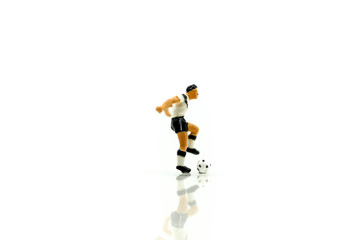 Miniature people : Soccer player man,football world championship cup concept.