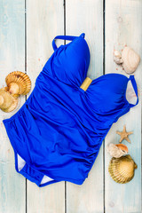 Closed female swimsuit in blue color