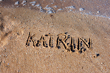 The inscription Katrin on the sand