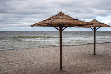 Straw umbrellas from the sun at sea.