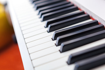 Close up of black and white piano keys.